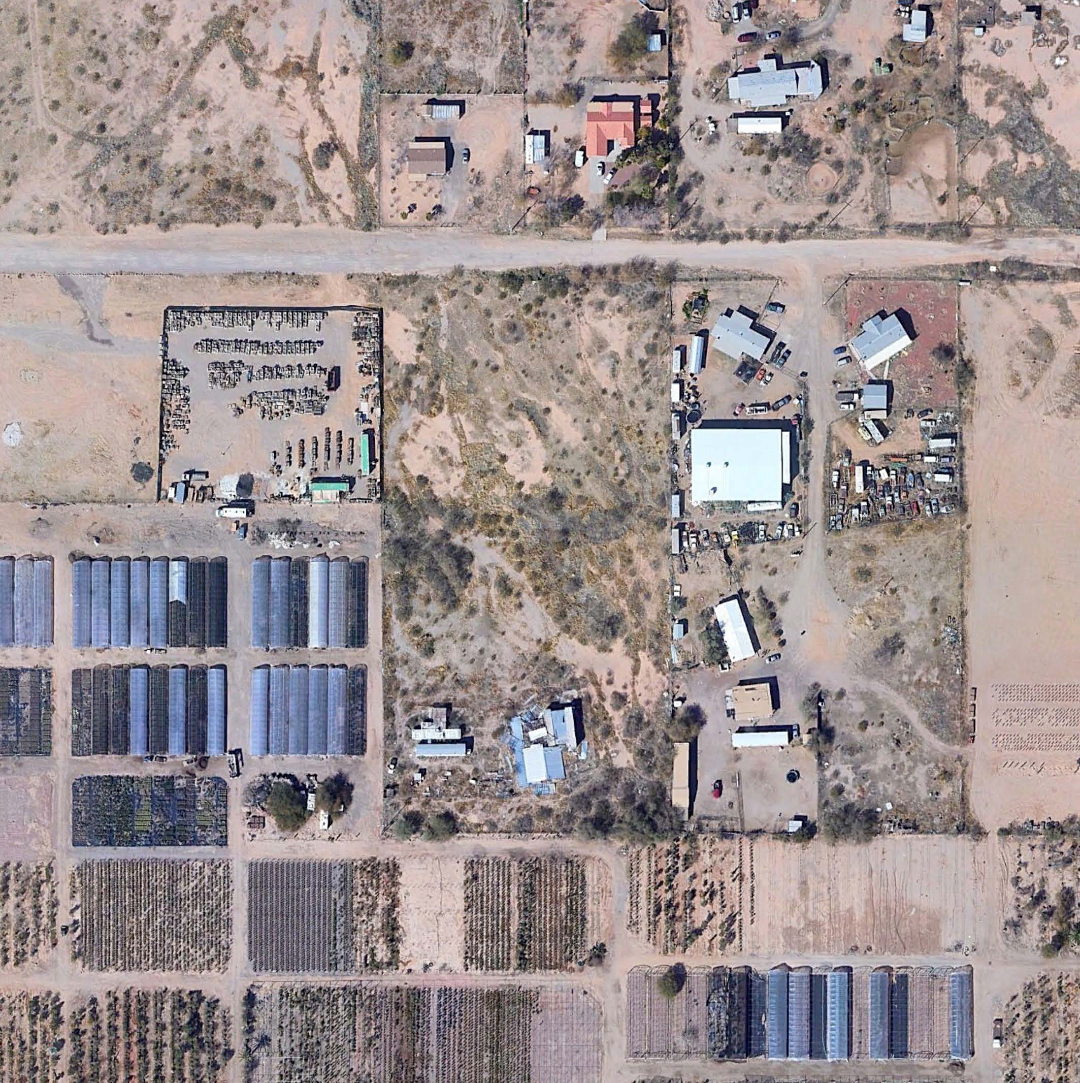 Aerial view of industrial property at 16039 W Planada Ln in Surprise, Arizona showing warehouse building, access points, and surrounding site area.