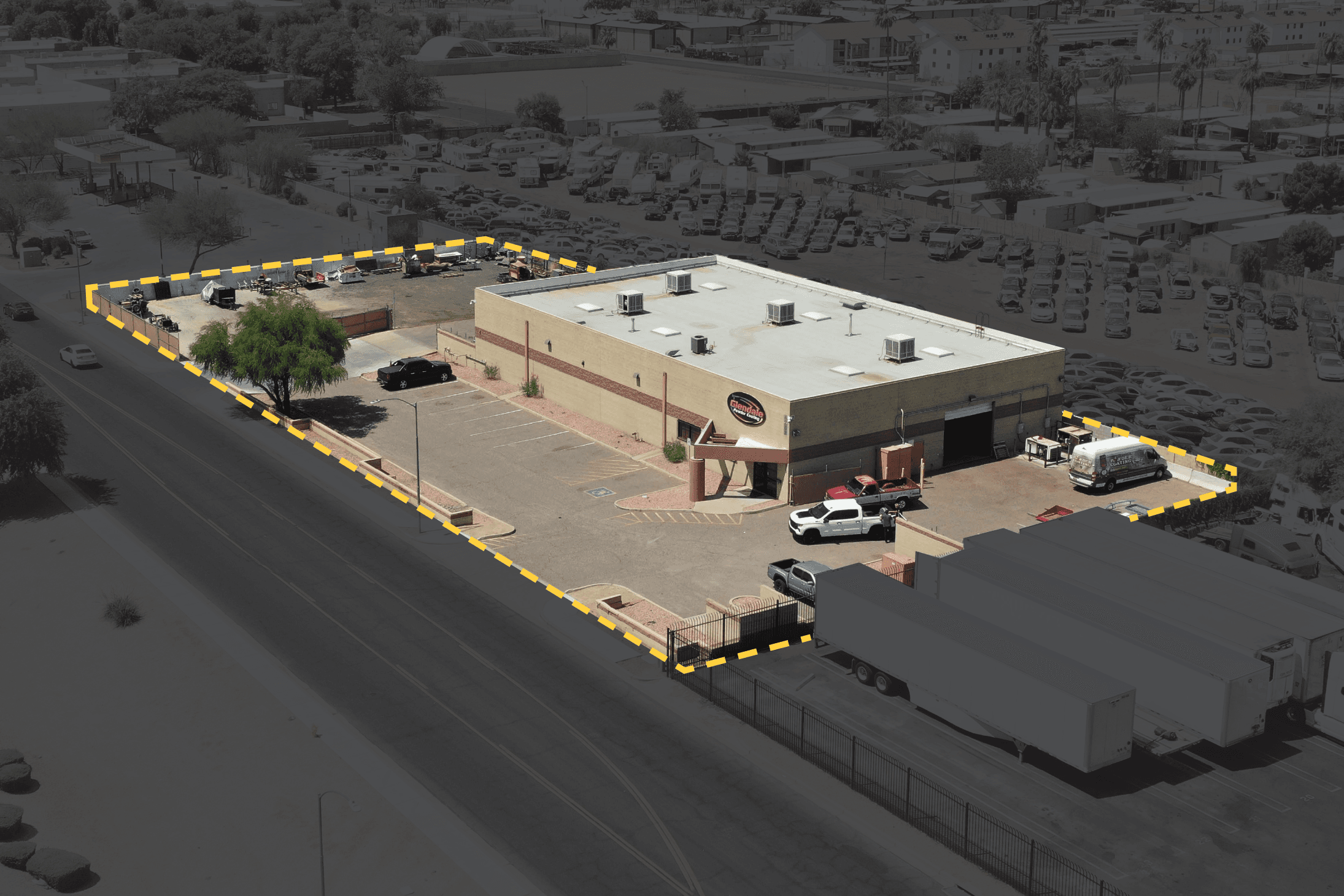 Aerial view of industrial property at 6262 N 57th Ave in Glendale, Arizona showing warehouse building, access points, and surrounding site area.