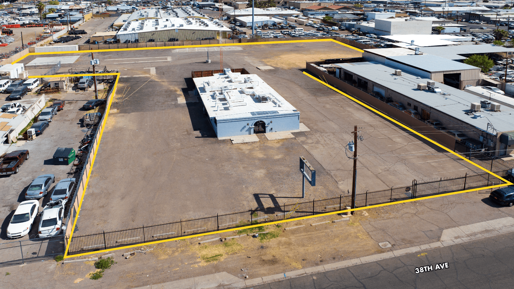 Aerial view of industrial property at 3883 N 38th Avenue in Phoenix, Arizona showing warehouse building, access points, and surrounding site area.