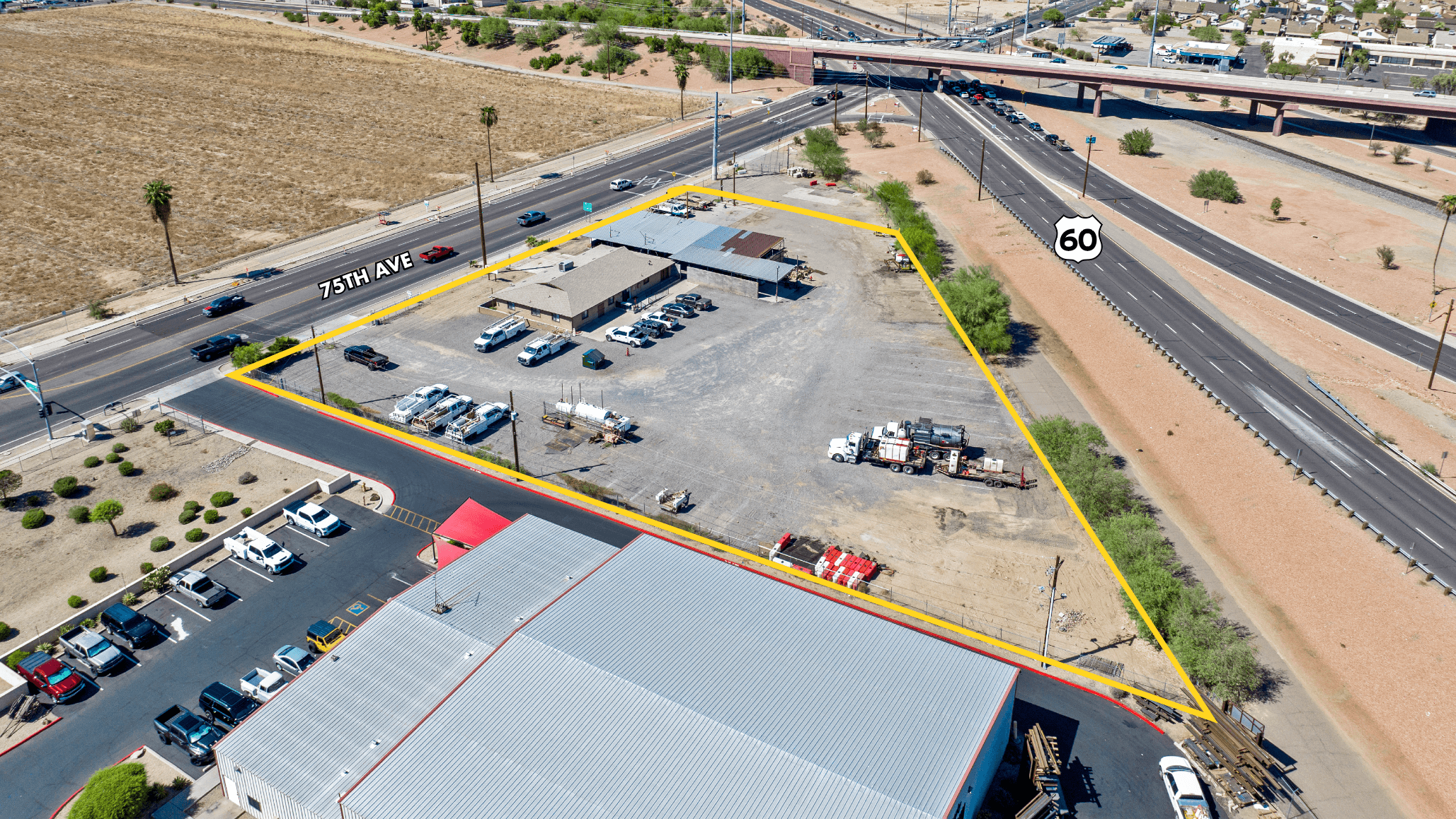 Aerial view of industrial property at 8789 N 75th Ave in Peoria, Arizona showing warehouse building, access points, and surrounding site area.