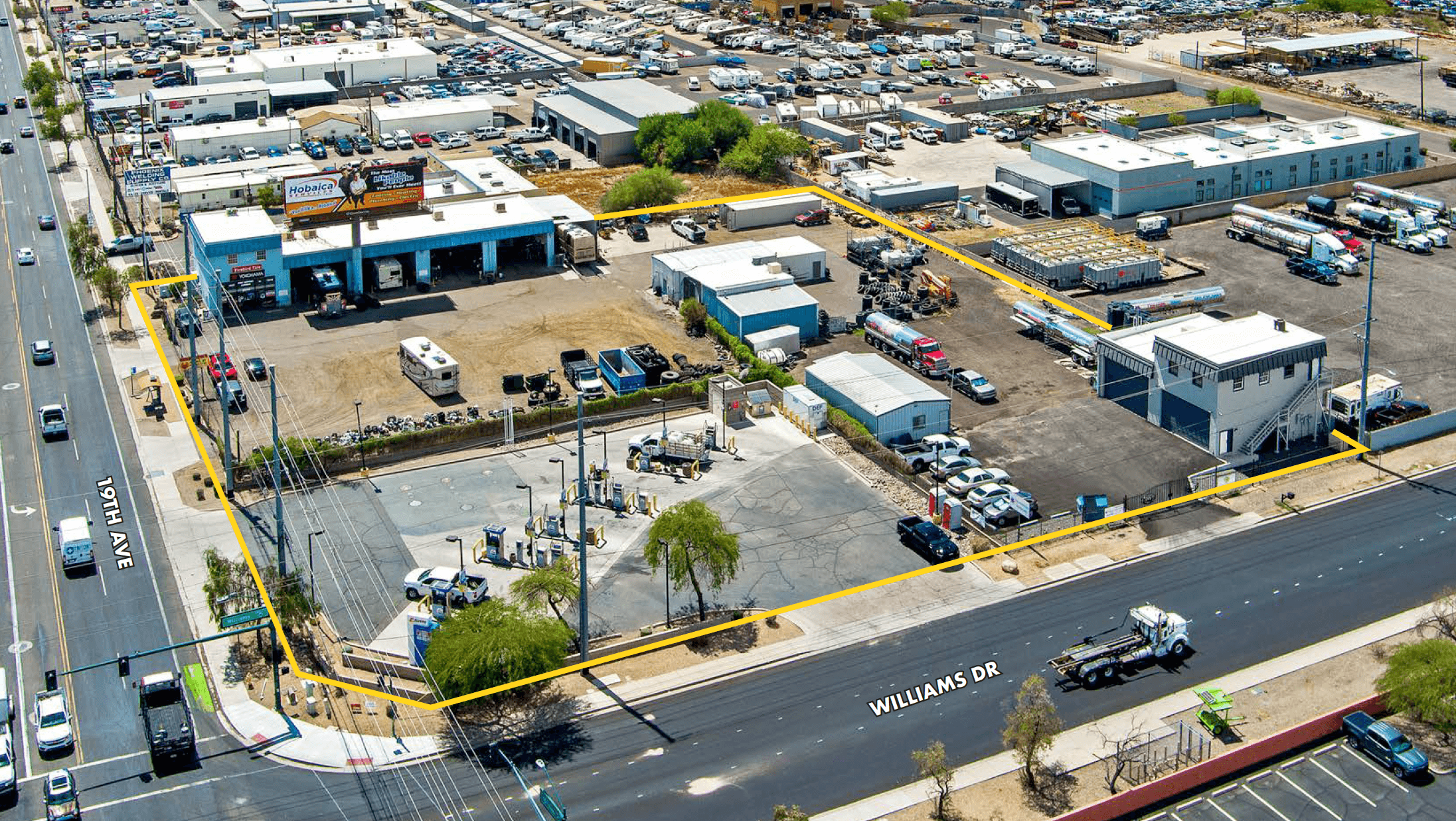 Aerial view of industrial property at 22444 N 19th Ave in Phoenix, Arizona showing warehouse improvements, yard area, truck access, and outdoor storage space.